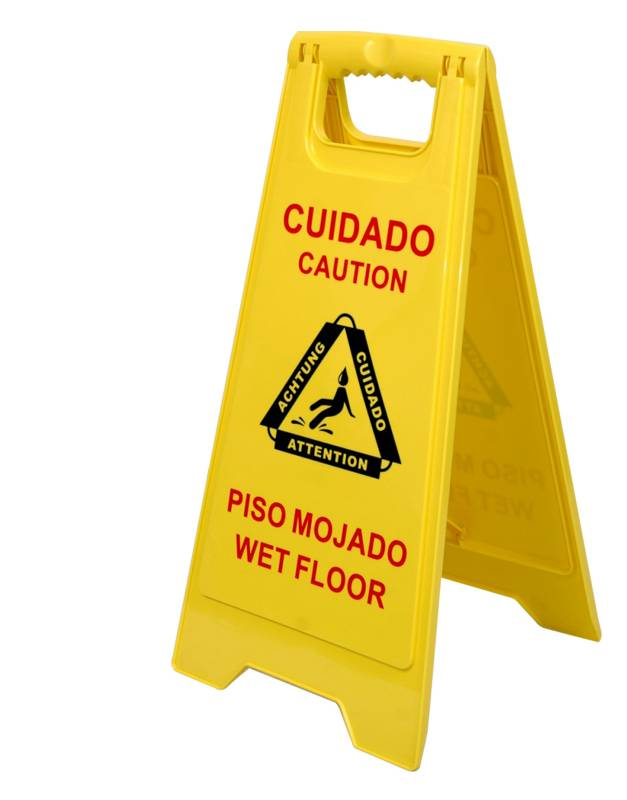 Fotografía comercial referencial de señal amarilla plegable con mensaje piso mojado; dimensiones y presentación se confirman al cotizar